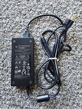 Shenzhen FJ-SW202821007150 switching power adapter. 
Input: 100-240V~ 50/60Hz 3